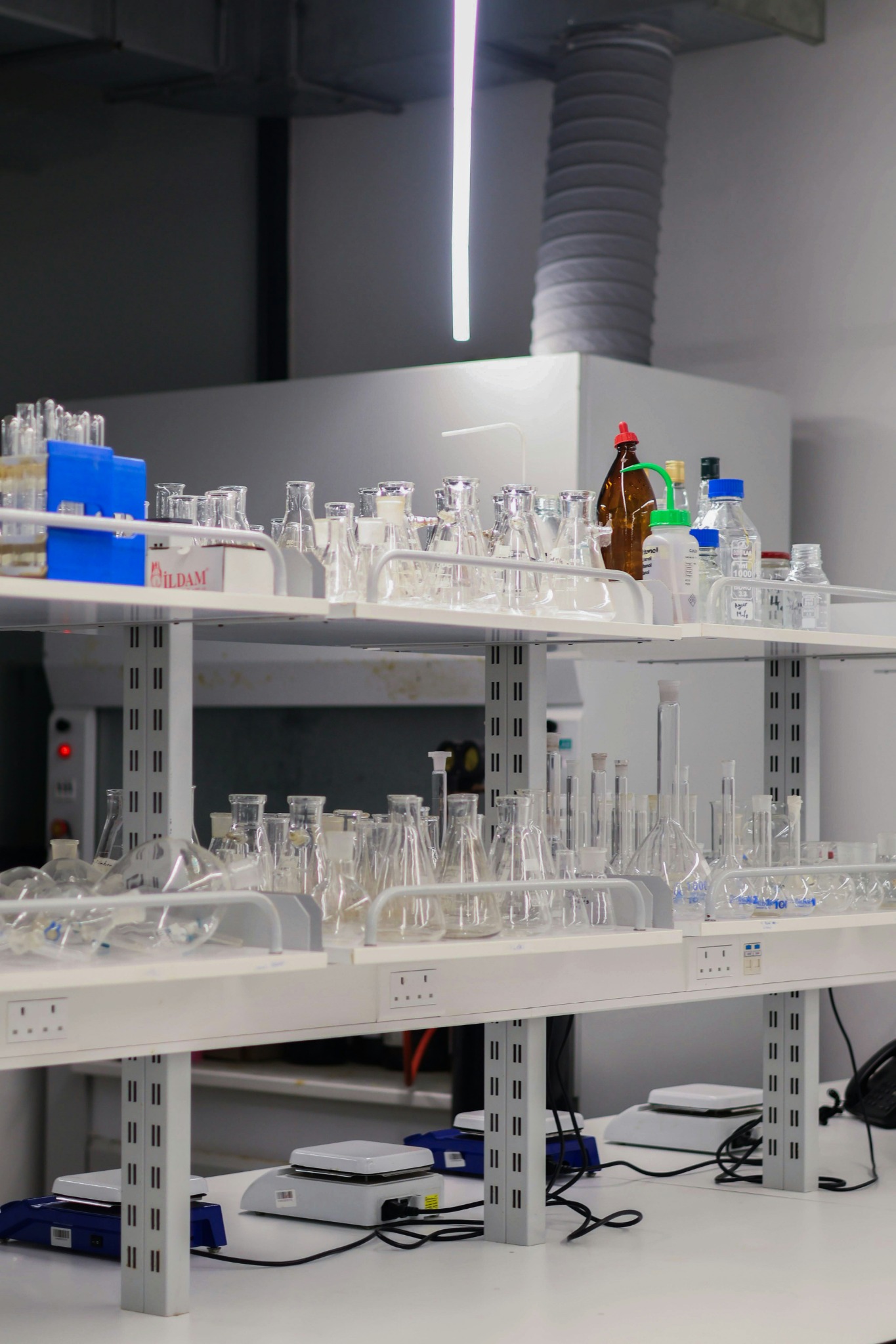 Laboratory glassware arranged on an instrument bench